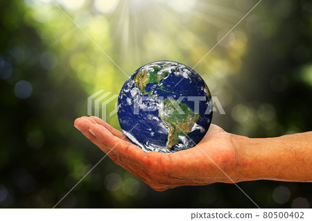 Hand holding planet earth on blurred green nature with sunlight background, elements of this image furnished by NASA, environmental concept 80500402
