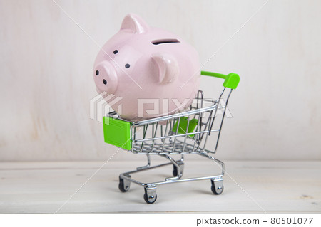 Pig piggy bank in a shopping cart. Pig piggy bank in a shopping cart. 80501077