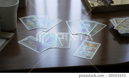Gold tarot cards on the table, esoteric concept, fortune telling and predictions Gold tarot cards on the table, esoteric concept, fortune telling and predictions 80501655