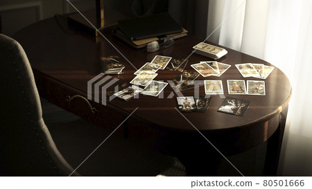 Blurred tarot cards on the table, esoteric concept, fortune telling predictions Blurred tarot cards on the table, esoteric concept, fortune telling predictions 80501666