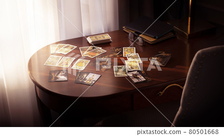 Blurred tarot cards on the table, esoteric concept, fortune telling predictions Blurred tarot cards on the table, esoteric concept, fortune telling predictions 80501668