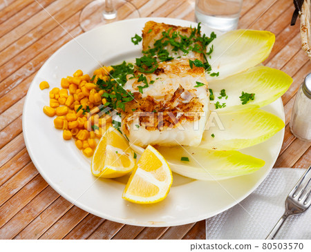 Fried rockling fillet with corn, lemon and greens 80503570