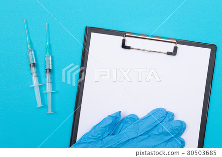 Vaccination or Revaccination Concept - Two Medical Syringe on Blue Table Vaccination or Revaccination Concept - Two Medical Syringe on Blue Table 80503685