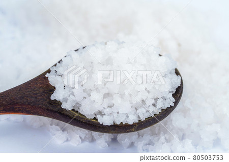 Salt herb in wooden spoon. 80503753