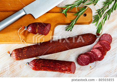 Raw smoked salami with fresh rosemary 80503855