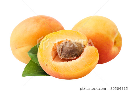 Apricots whole and half with green leaves on a white background, cut apricots. Isolated 80504515