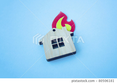 Fire house, insurance and mortgage concept. Small wooden house Fire house, insurance and mortgage concept. Small wooden house 80506181