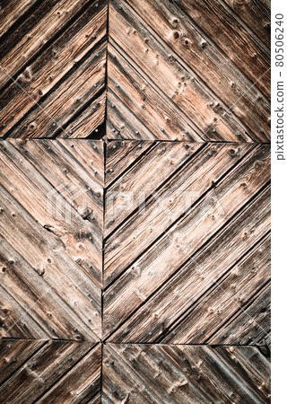 Geometric abstract closeup of natural aged and rural rustic wood surface of recycled weathered planks constructed in creative, decorative lines, old vintage wooden background or backdrop with space 80506240