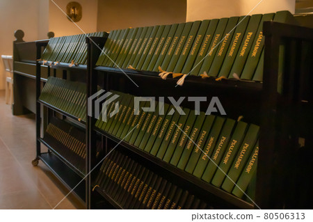 Porvoo, Finland - 2 October 2019: Closeup of a row of green hymn books on swedish language in Porvoo Cathedral. 80506313