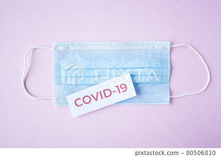 The inscription quote covid-19 on a medical mask 80506810