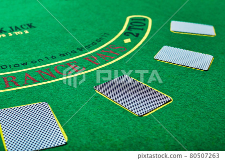 Playing cards on green table surface. Casino, gambling, poker concept Playing cards on green table surface. Casino, gambling, poker concept 80507263