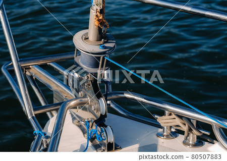 rope on the winch of a white yacht in the sea.yacht equipment rope on the winch of a white yacht in the sea.yacht equipment 80507883