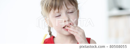 Little girl with closed eyes eating delicious fries Little girl with closed eyes eating delicious fries 80508055