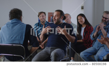 Optimistic reformed addict talking about life without alcohol during AA meeting Optimistic reformed addict talking about life without alcohol during AA meeting 80508198