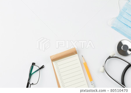 Notebook with stethoscope and mask. 80510470