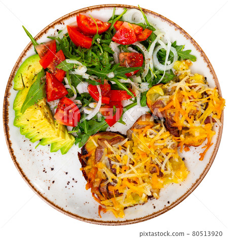 Pork with baked potatoes and vegetable salad Pork with baked potatoes and vegetable salad 80513920