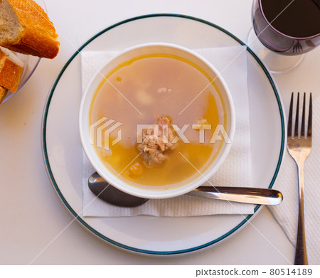 Soup with pasta, meatballs, potato slices and chickpeas 80514189