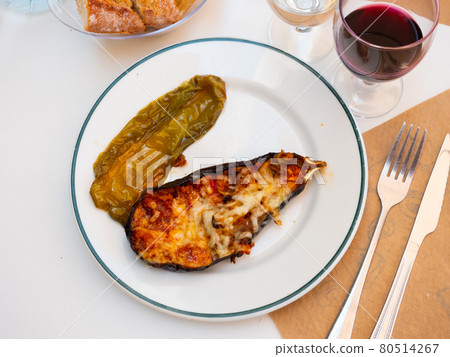 Grilled stuffed eggplant with baked green bell pepper Grilled stuffed eggplant with baked green bell pepper 80514267