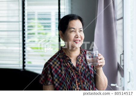 Senior asian woman hands holding a glass of water,Elderly healthy and lifestyle concept Senior asian woman hands holding a glass of water,Elderly healthy and lifestyle concept 80514517