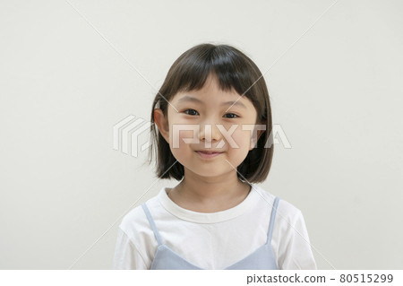 Second grade girl looking at the camera portrait Second grade girl looking at the camera portrait 80515299