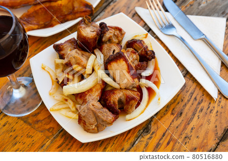 Grilled pork meat shashlik with marinated onion Grilled pork meat shashlik with marinated onion 80516880