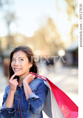 Shopping woman thinking on La Rambla, Barcelona Shopping woman thinking on La Rambla, Barcelona 80517630