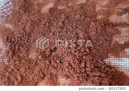 Cocoa powder isolated on sillicone baking mat. 80517893