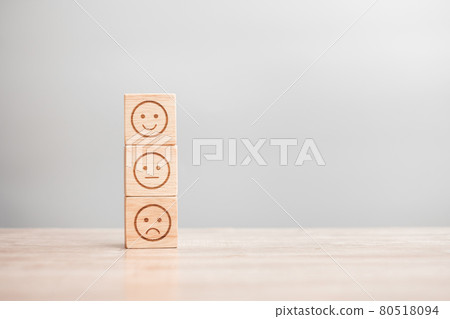 emotion face symbol on wooden blocks. Service rating, ranking, customer review, satisfaction, evaluation and feedback concept emotion face symbol on wooden blocks. Service rating, ranking, customer review, satisfaction, evaluation and feedback concept 80518094