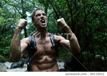 Muscular survivor man in jungle rainforest 80519032