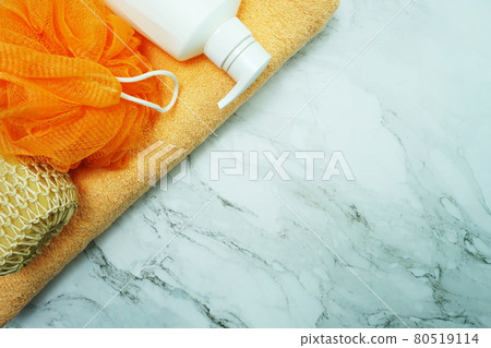 Shower accessories bath items shower bottle, sponge and fibre scrub on marble background Shower accessories bath items shower bottle, sponge and fibre scrub on marble background 80519114