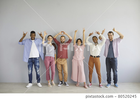 Group of happy multiracial people showing positive hand gestures like OK, thumbs up, etc Group of happy multiracial people showing positive hand gestures like OK, thumbs up, etc 80520245