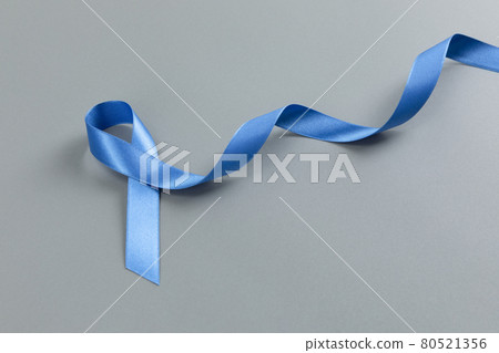 Blue ribbon on gray background Blue ribbon on gray background 80521356