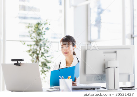 Female doctor in online practice Female doctor in online practice 80521427
