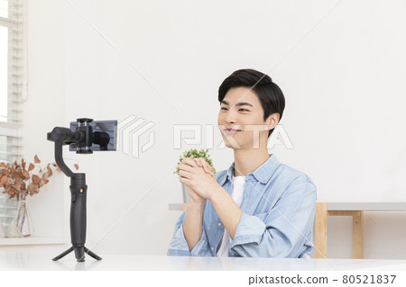 Asian male taking video with smartphone, content creator concept Asian male taking video with smartphone, content creator concept 80521837