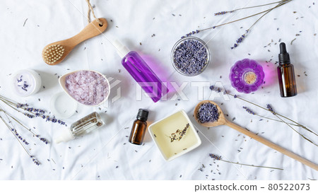 Variety of organic lavender cosmetics on white background top view. 80522073