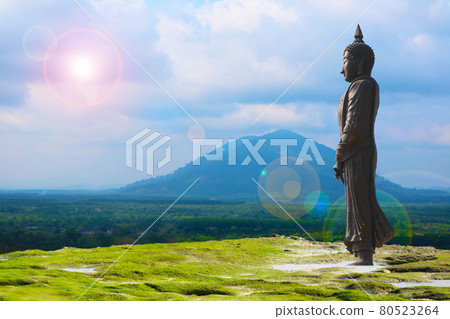 Buddha looking seven day style and sun back cloud over mountain background Buddha looking seven day style and sun back cloud over mountain background 80523264