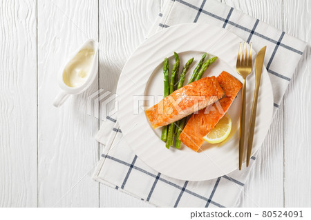 roast salmon fillets with lemon and asparagus roast salmon fillets with lemon and asparagus 80524091