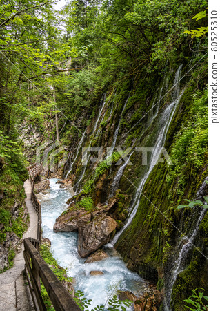 Beautiful Wimbachklamm gorge with wooden path at Ramsau bei Berchtesgaden in Germany Beautiful Wimbachklamm gorge with wooden path at Ramsau bei Berchtesgaden in Germany 80525310