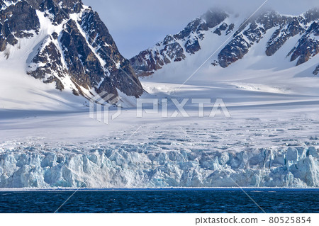 Deep Blue Glacier and Snowcapped Mountains, Arctic, Svalbard, Norway 80525854