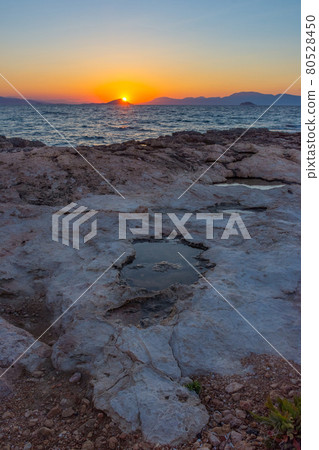 Beautiful sunset at Mediterranean Sea with wild and rocky beaches 80528450