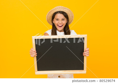 Little girl summer style hold blackboard announcement copy space, exciting advertisement concept Little girl summer style hold blackboard announcement copy space, exciting advertisement concept 80529074
