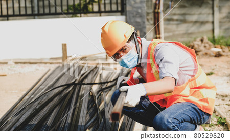 Engineer contractor man work safety industry project, check investigating the size and quality of steel used in building construction structures site 80529820