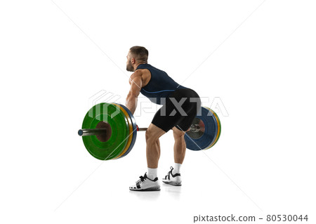 Full length portrait of a man in sportswear exercising with a weight isolated on white background 80530044