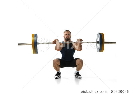 Full length portrait of a man in sportswear exercising with a weight isolated on white background 80530096