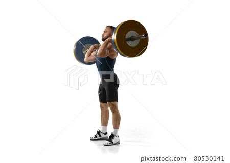Full length portrait of a man in sportswear exercising with a weight isolated on white background 80530141
