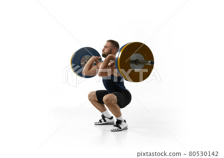 Full length portrait of a man in sportswear exercising with a weight isolated on white background Full length portrait of a man in sportswear exercising with a weight isolated on white background 80530142