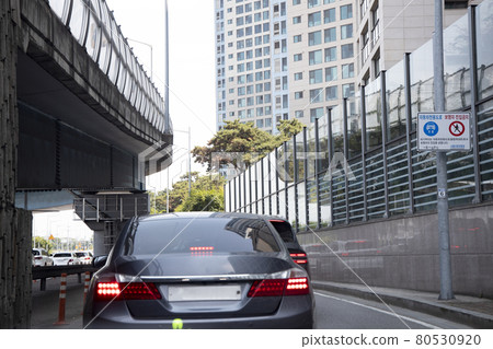Car driving under an elevated highway Car driving under an elevated highway 80530920