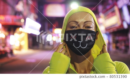 Woman close up look caucasian at Pattaya Walking Street with wearing protective medical mask. Lockdown quarantine isolation. Coronavirus covid-19. 80531390