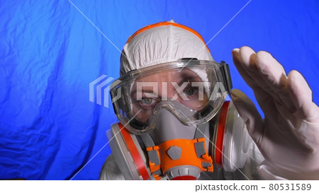 Scientist virologist in respirator. Woman close up look, wearing protective medical mask. Concept health safety N1H1 coronavirus epidemic 2019 nCoV. Scientist virologist in respirator. Woman close up look, wearing protective medical mask. Concept health safety N1H1 coronavirus epidemic 2019 nCoV. 80531589