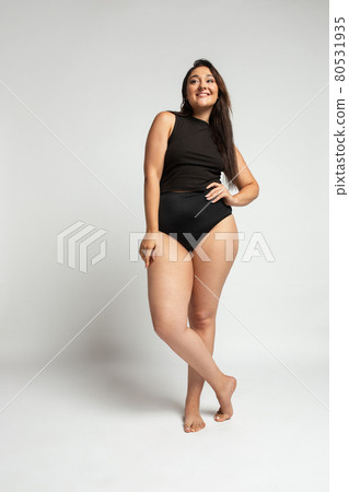 Young beautiful plump woman in cotton underwear on white background Young beautiful plump woman in cotton underwear on white background 80531935